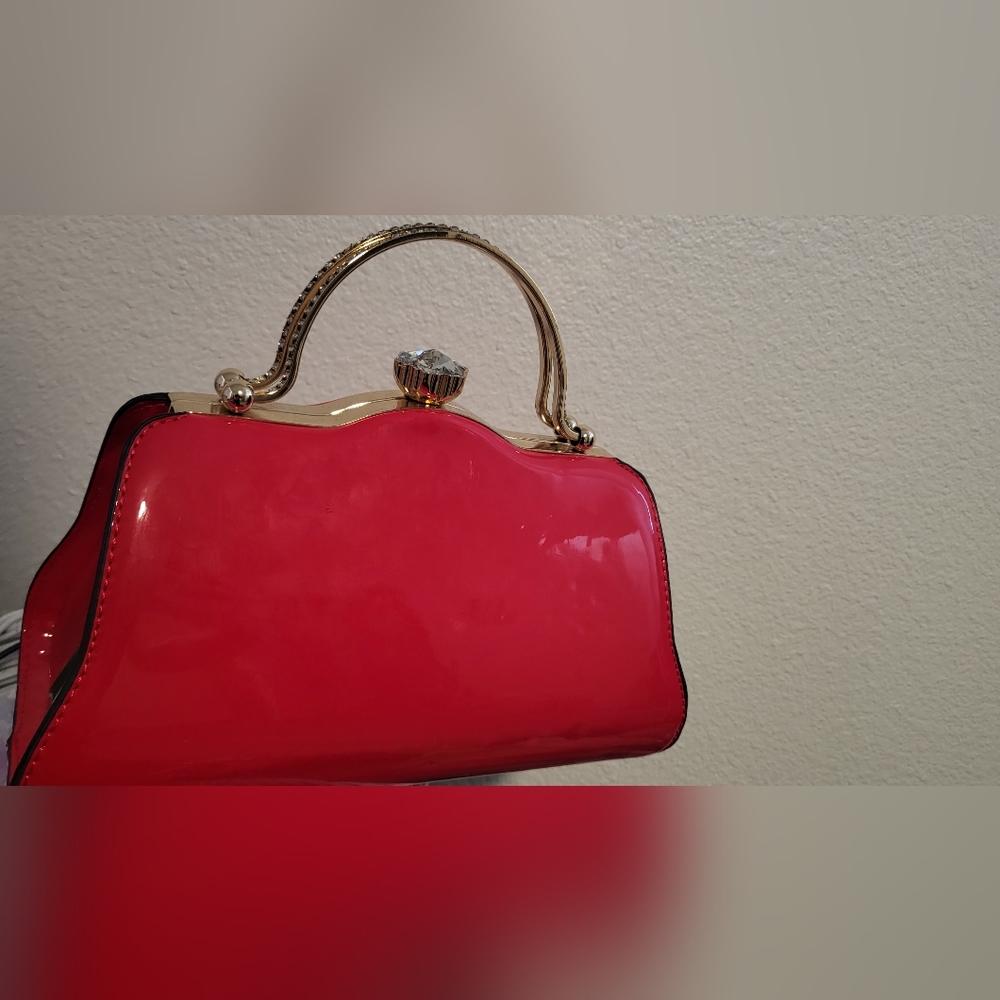 Elegant Red Handbag with Gold Accents